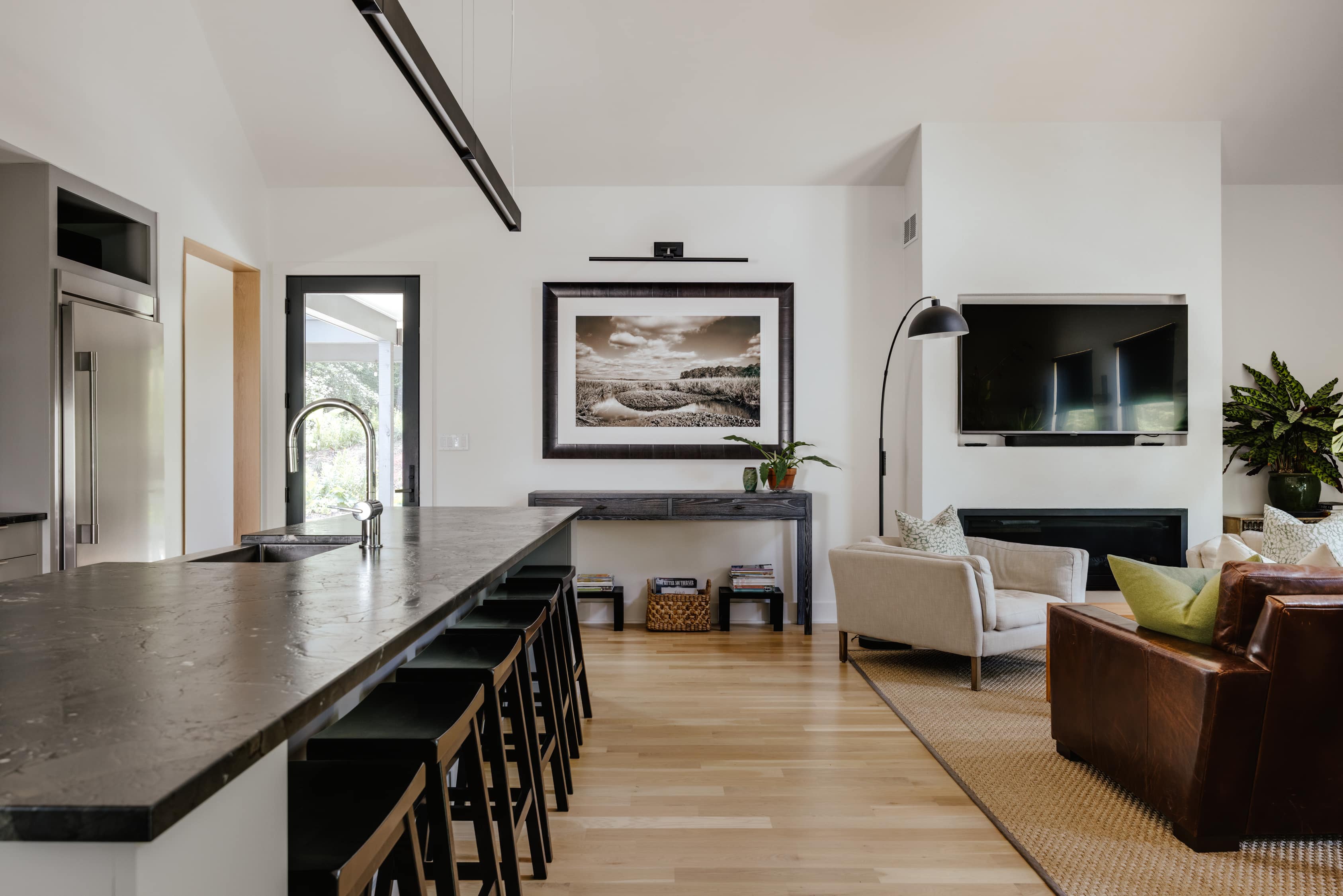 Modern farmhouse interior living space featuring a contemporary open concept, showcasing a built home design from Prim Haus house plans.