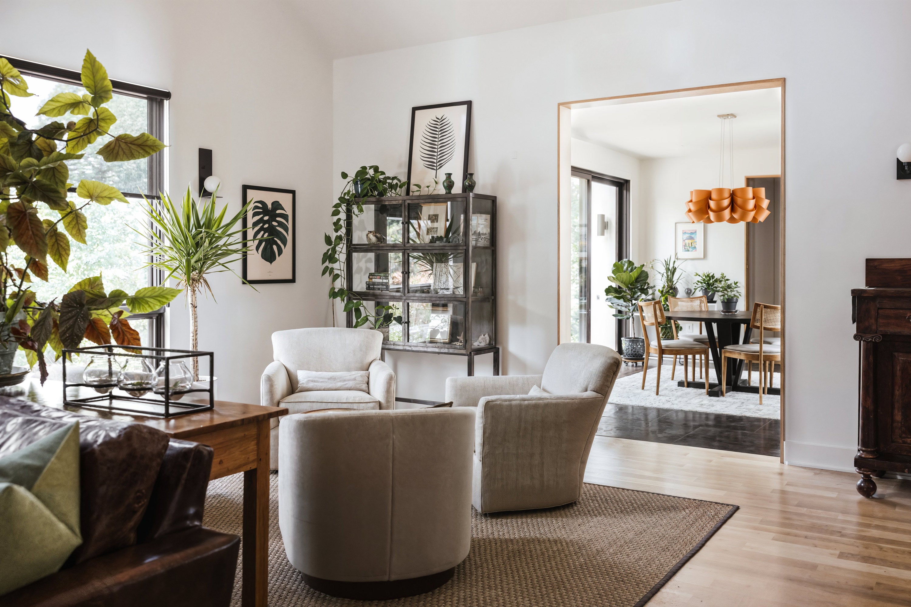 Modern farmhouse interior living space featuring a contemporary open concept, seating and furniture, showcasing a built home design from Prim Haus house plans.