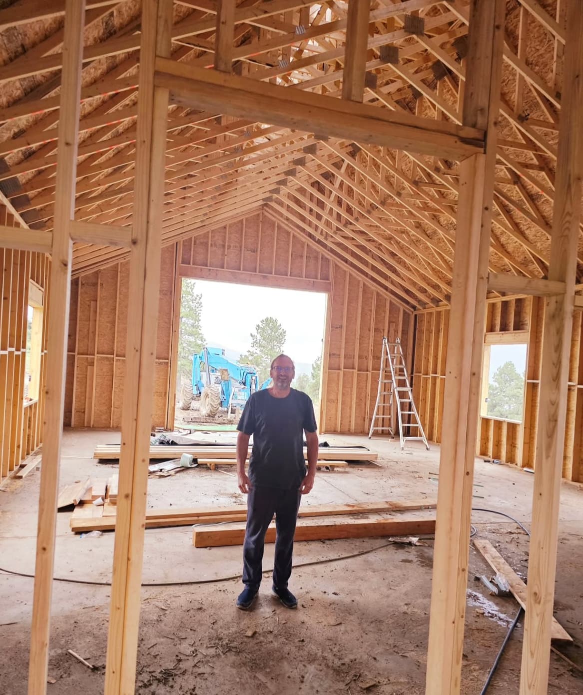 Happy Prim Haus client building a Scandinavian-style modern rambler house with an RV garage.